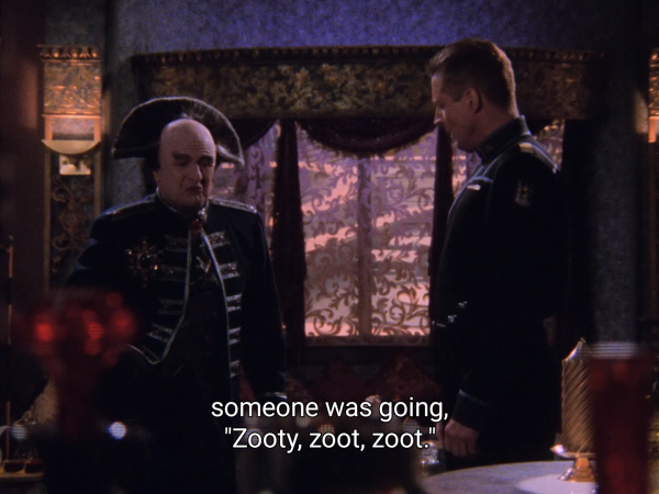 Picture of Londo talking to Sheridan in Londo's quarters.

The caption means: "someone was going, 'Zooty, zoot, zoot.'"