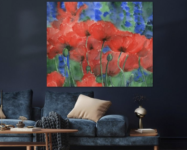 Red poppies with blue delphinium flowers is a hand-painted watercolour painting in landscape format by the artist Karen Kaspar.
Bright red poppies and deep blue delphiniums bloom together in a flower bed in a summer garden. The red poppies are the focal point of the painting. Their luminosity is further emphasised by the contrasting background of cool blue and green tones. The picture is painted in a loose, flowing style, which gives the flowers a sense of movement, as if they are swaying in the summer wind.