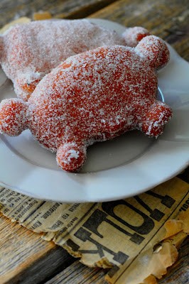 A fried pastry with sugar coating and jam filling