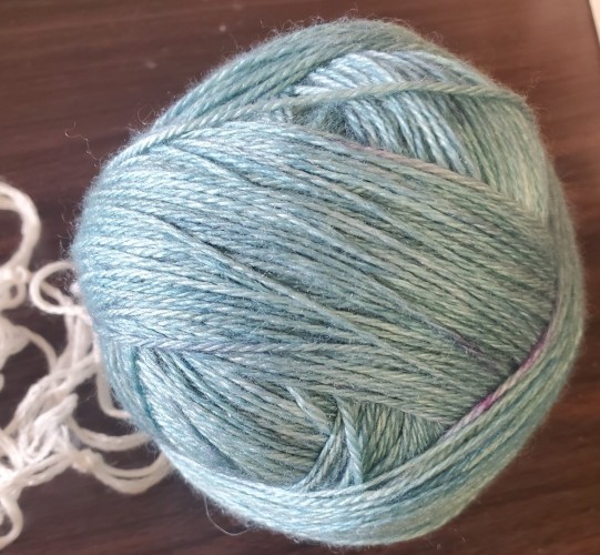 The re-wound ball of Robin's egg blue yarn, now erer of any excess dye
