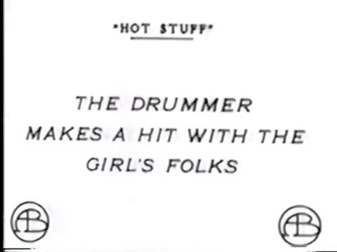 An intertitle of the film where it is written: "The drummer makes a hit with the girl's folks".