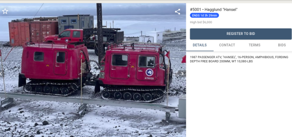Hagglund vehicle - tracked antarctic exploration vehicle with two segments, painted red. Seen at McMurdo Antarctic Base.
