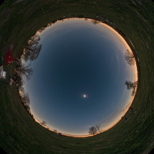 Distorted image of the horizon around a particular place during a solar eclipse.