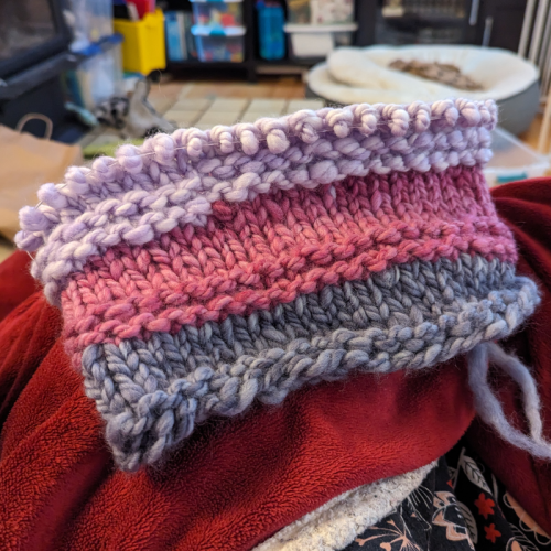 A cowl in progress, currently made with 3 colours of thick handspun yarn (but two more are planned).