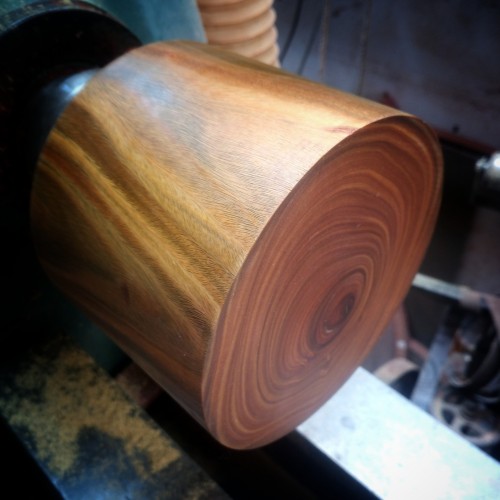 A 5 inch chunk of lignum vitae wood set up the lathe ready for turning.