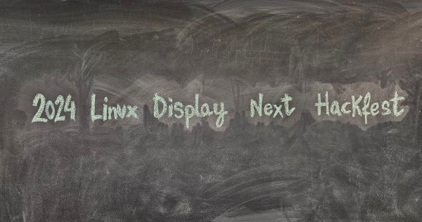 A 2024 Display Next Hackfest sign written with chalk on a blackboard