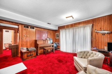 The quintessential 70's room. Wood panel walls and the most RED shag carpet you can think of. I mean like, this is the color of blood that Akira Kurosawa used in Ran. Also, the carpet runs all the way down the hall and into the bathroom. That's right folks, carpeted toilet.