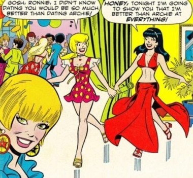 A panel from a vintage Archie Comics magazine. At a party, Betty and Veronica are walking hand in hand, with wide smiles on their faces. Betty says: “Gosh, Ronnie, I didn’t know dating you would be so much better than dating Archie!” Veronica replies: “Honey, tonight I’m going to show you that I’m better than Archie at everything!”In the corner of the image, a third woman looks right at the viewer with a knowing smile.