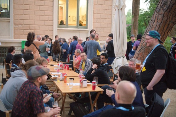 Members of the KDE community meeting outside for food and drinks at Akademy 2022 at Barcelona