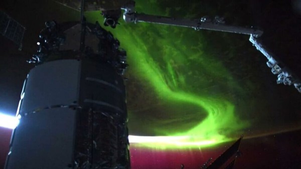 Astronauts observe massive auroras enveloping the Earth as the Sun approaches its peak in solar activity, nearing its 11-year cycle maximum.