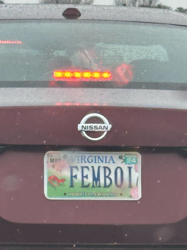 Here, we see a Nissan car with a vanity plate that reads as VIRGINIA FEMBOI 