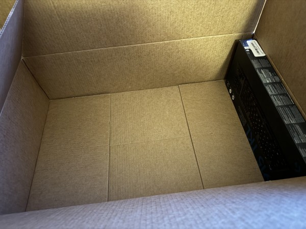 A photo of an Amazon shipping box, with the product taking up maybe one-fifteenth of the space available.