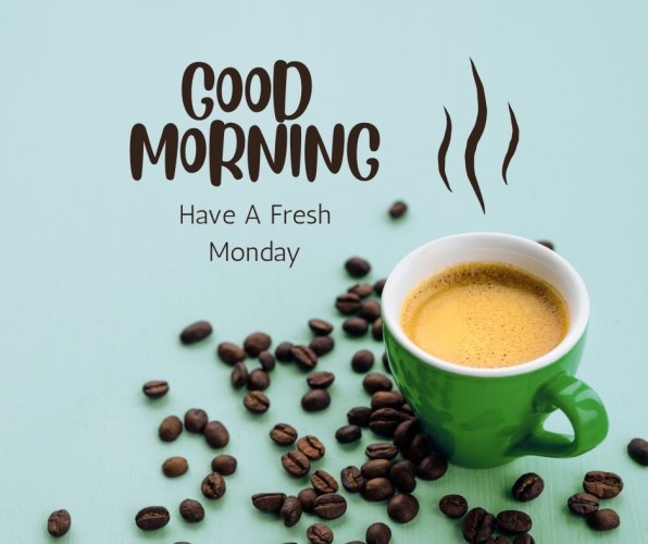 The image features a message that says "GOOD MORNING Have A Fresh Monday" in dark brown, stylized font on a light teal background. To the right, there is a green cup filled with coffee, with steam lines rising above it, suggesting it's hot. Scattered around the bottom left of the cup are numerous coffee beans. The overall vibe is cheerful and energizing, perfect for a Monday morning.