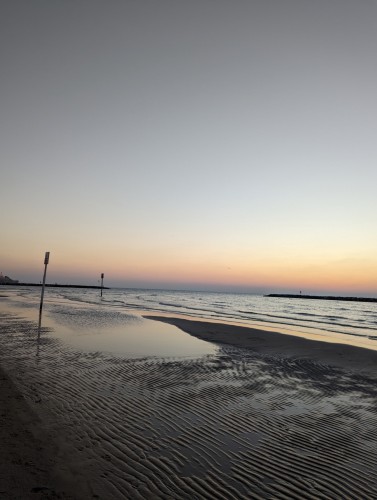A photo of the beach and sea at sunset in Israel