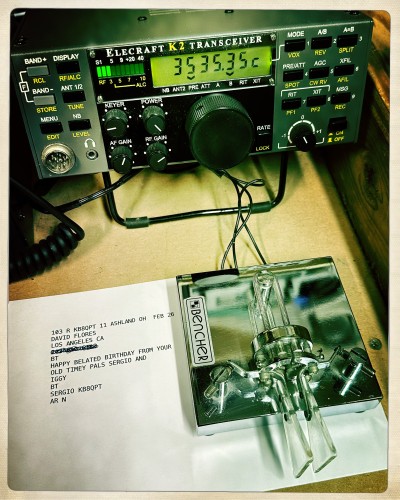 Image of an amateur radio sending a happy birthday message to a friend via Morse code over RF