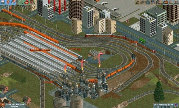 🕶️ An aerial view of a station located near a factory and a town, with its trains carrying tankers and passengers respectively. Its ballasted rails describe real curves.

📚️ Chris Sawyer's Locomotion is a 2.5D construction and management simulation game in various times (from 1900 to 2006) and places (North America, the United Kingdom and the Alps). The player tries to make his transport company (trains, trams, buses, trucks, ships and planes) prosper against other competitors (IAs) with different secondary objectives depending on the scenarios, in a changing world. OpenLoco is a libre & multi-platform, single-player / multi-player, C++ re-implementation (the original mixed x86 assembly code with the RollerCoaster Tycoon 2 engine) of its engine, derived from that of OpenRCT2.