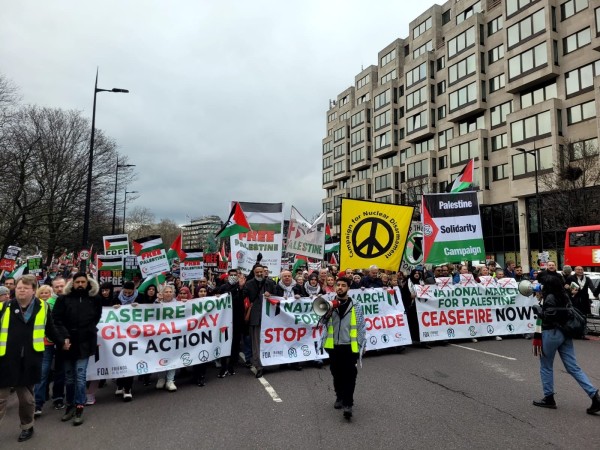 Lead banners of Palestine Solidarity Committee and CND stretch across Park Lane at the head of the Feb 17 London march on the Global Day of Action calling for 'Ceasefire Now' and 'Stop the Genocide'