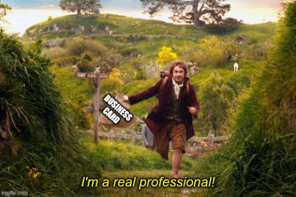 Screenshot from The Hobbit movie of Bilbo baggins leaving to go on an adventure. He has a long scroll in his hand. The caption on the scroll reads "Business Card" and the subtitle reads "I'm a real professional!"