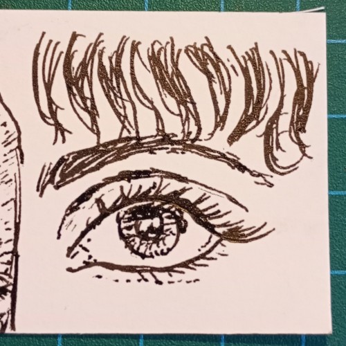 An ink drawing of an eye looking off to the right, with the suggestion of a fringe above the eyebrow.

A practice drawing on paper. 