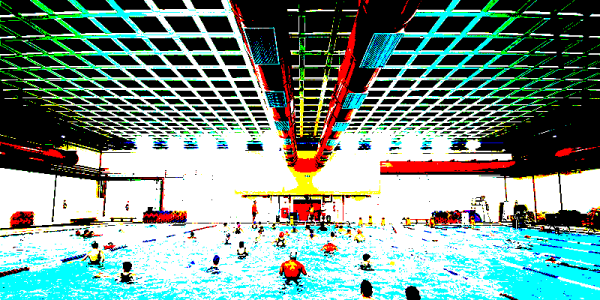 a picture of a swimming pool with very saturated yellow, red, green & blue colors, plus black and white.
